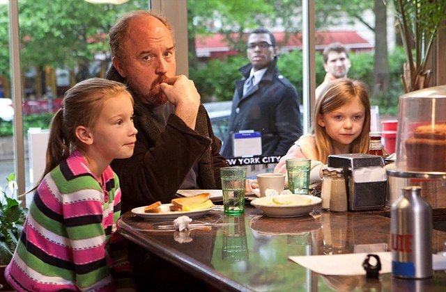 Louis C.K. as his TV alter-ego Louie, with his TV daughters
